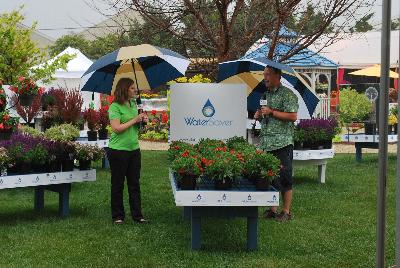 Seen @ Spring Trials 2016.: PlantHaven CEO Robert Bett outlining some of the features and benefits of the WaterSaver™ Program to GIE Media Editor Karen Varga during a downpour at Spring Trials, 2016.  Might be all the water these plants need for a while....
